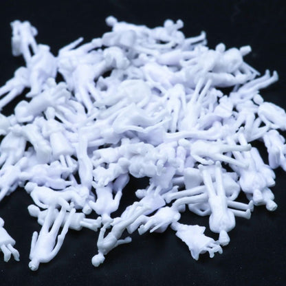 100x Figuren stehende & sitzende Reisende für Spur Z (1:200) - unbemalt